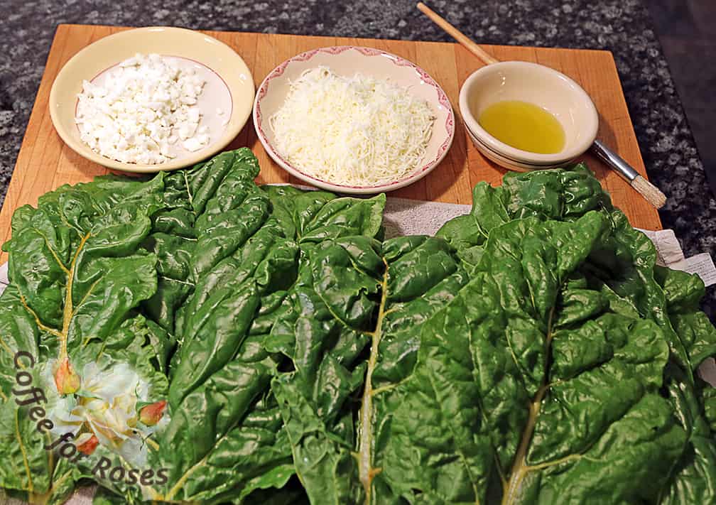 You need large chard leaves, the cheese of your choice, and olive oil. I used some shredded 6-cheese Italian mix and some fat-free feta cheese.
