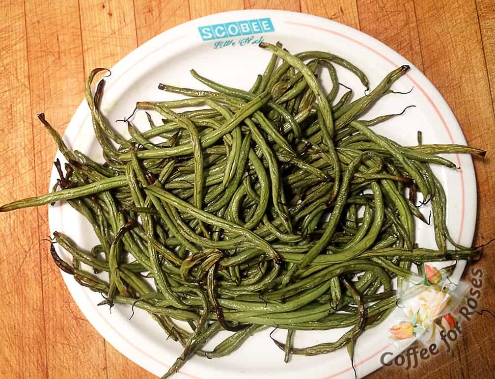Turn the wilted, browned beans onto a plate. Sprinkle with salt to taste or, for those on a salt-free diet use curry or chili powder to taste.