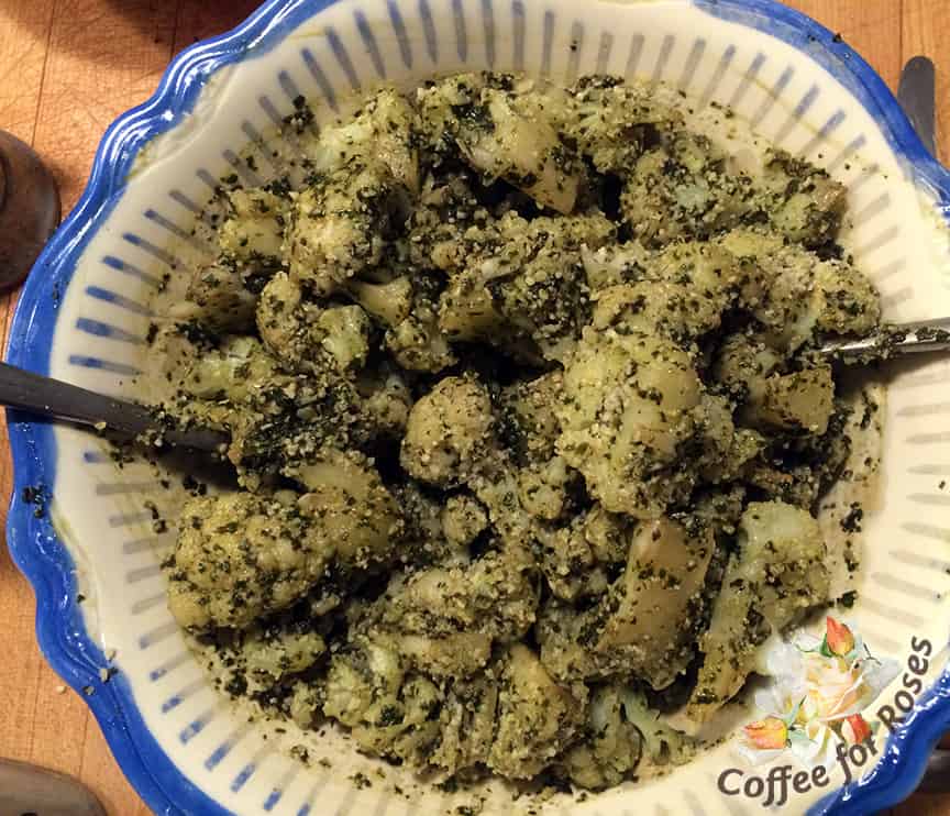 Drain the cauliflower into a sieve and then put it into a bowl. Toss with the pesto, adding more olive oil if desired. Add the grated cheese and salt and pepper to taste - serve immediately.