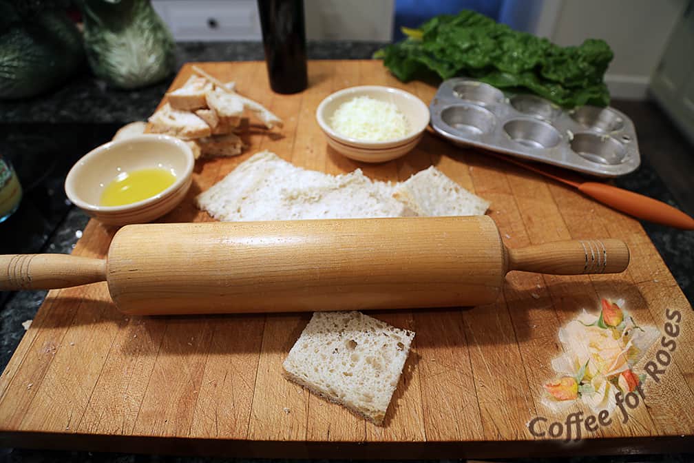 Take a rolling pin and roll over each bread square, rolling in both directions to flatten the bread.
