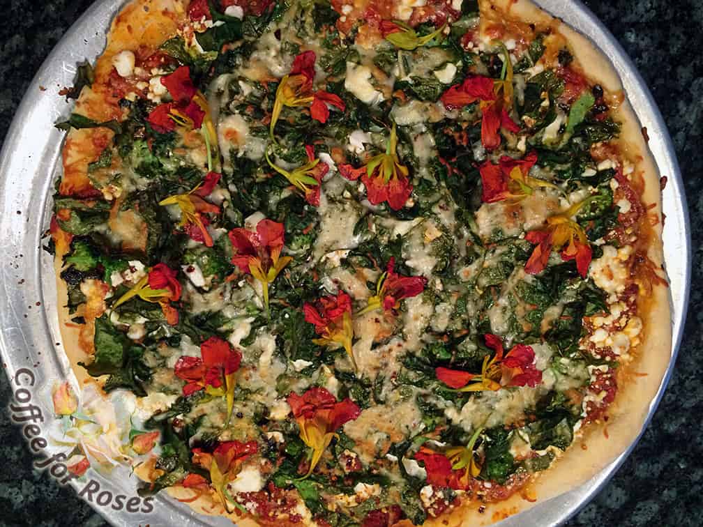 This pizza had garden broccoli, chard, and nasturtiums on top. 