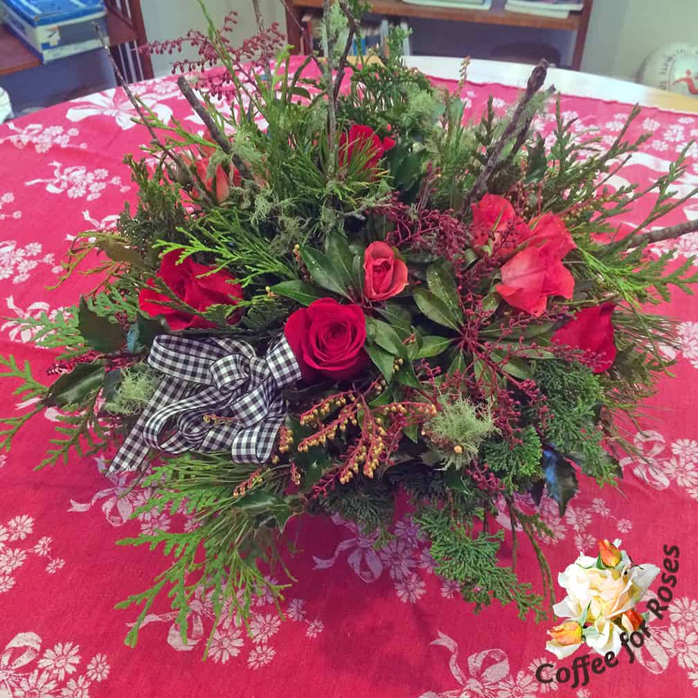 This was the last arrangement I made and when I was putting it together I wanted an element that was lighter in color. So I went out into the yard and picked up a bunch of twigs that had lichen on them, and added these to the arrangement. Plus the checked bow.