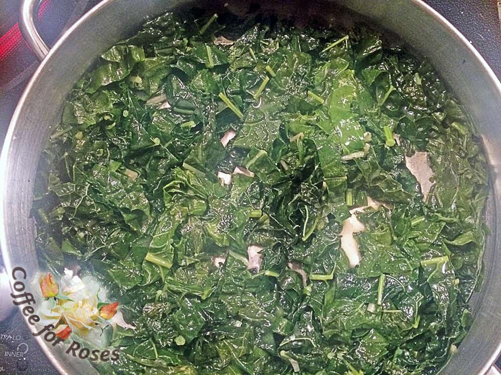 Put some olive oil in a saute pan and add the garlic, kale and chard. Stir for a couple of minutes and then add about half a cup of stock. Cover the pan.