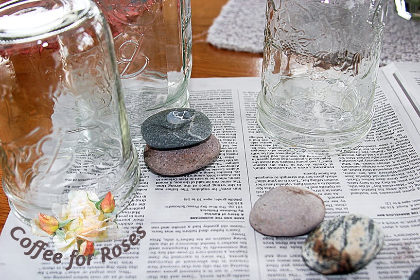 Put a dab of adhesive on each rock and place the next on top of that glue. Lean the pile against a jar or other heavy upright object for support.
