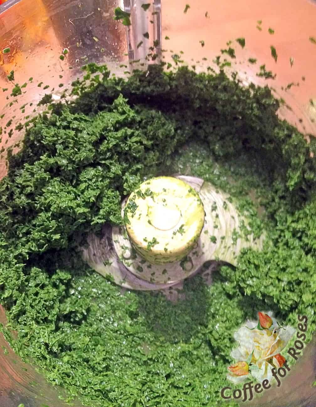 Put all the greens in a food processor with the olive oil and salt and pepper to taste. Blend well.