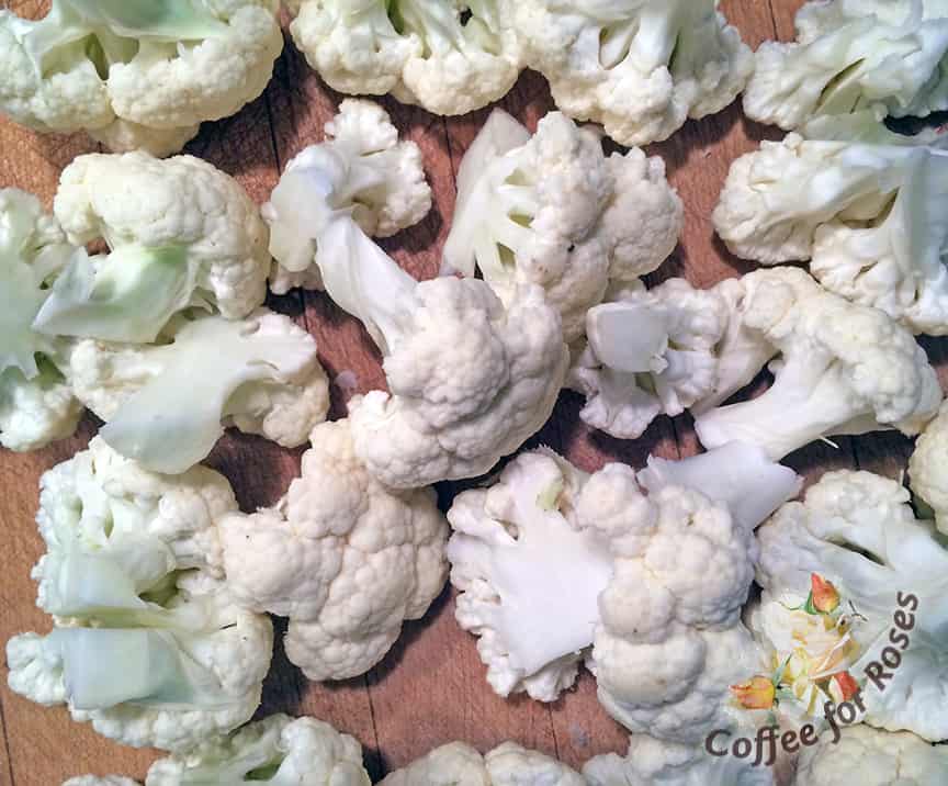 Chop the cauliflower into medium size pieces so that they will all steam at the same rate. Heat some water to boiling in a saucepan or steamer and add the cauliflower and cover. Cook for five to seven minutes, turning once. The cauliflower should be soft but not falling apart when you touch it.