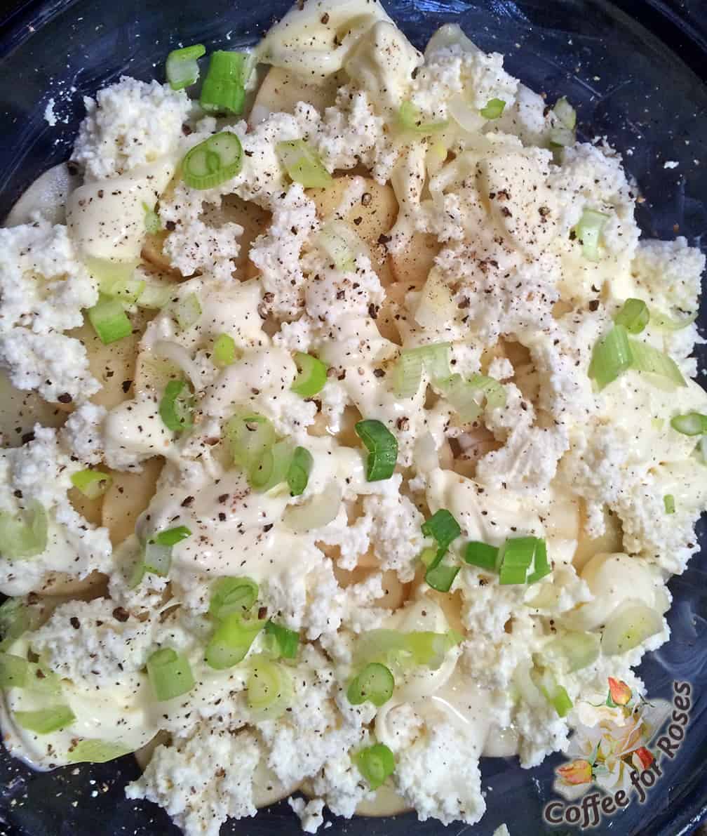 Next I followed with another layer of potatoes topped by Crème fraîche, some of the goat cheese, and some ricotta and scallion. I repeated these layers, potato/kale/cheese/scallions again. 