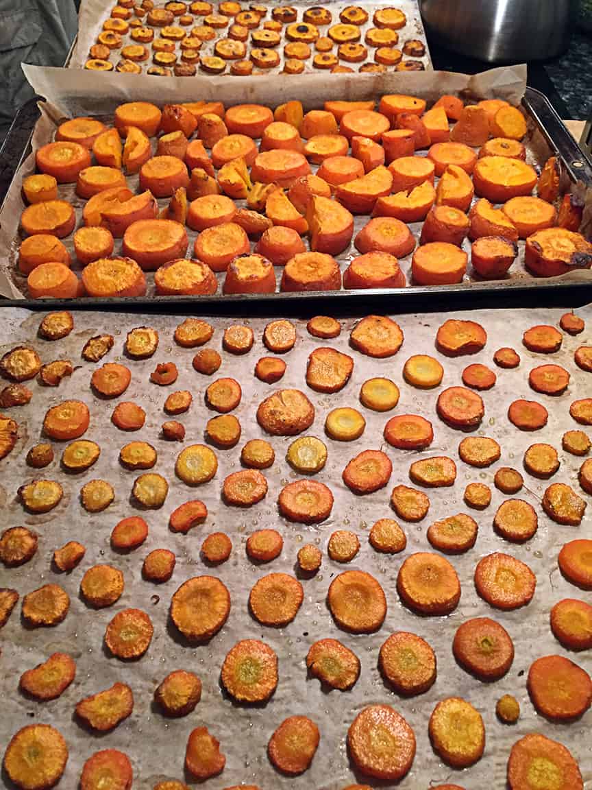We slice the carrots into various sizes and place them on parchment paper in a 375 oven. Roast until they are starting to brown and are soft - roasting brings out the sweetness. Cook these before piling them into zip-lock freezer bags.