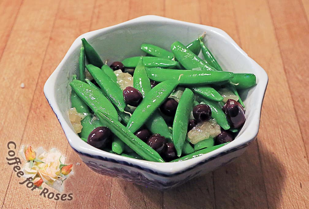 Once the peas are cooked add the olives (pitted) and cheese. Toss and serve immediately.