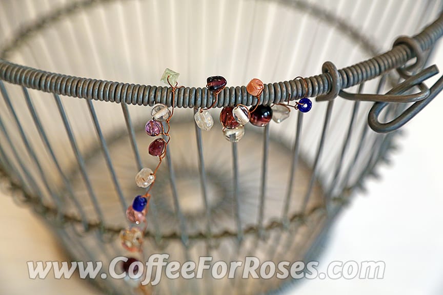 One way of putting the wired beads on the basket is to wind them around the top rim.